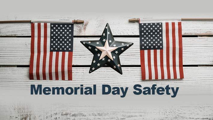 Two flags and a star with the text Memorial Day Safety.